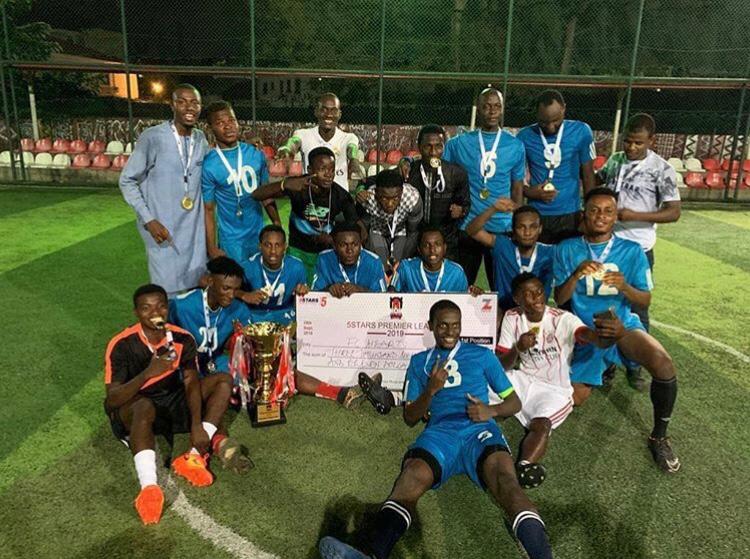 FC Hearts posing after the match with cash prize in the form of a check