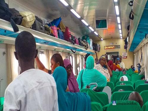 passengers boarding a train