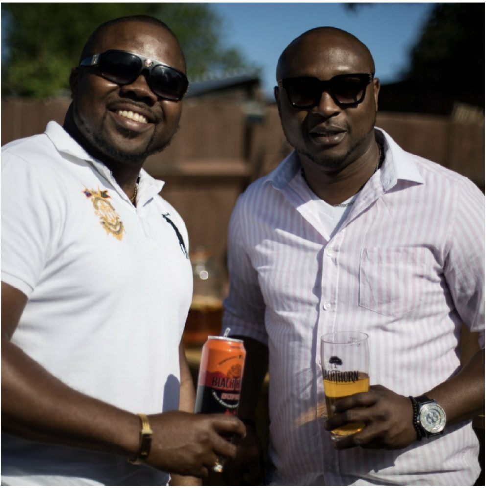 Men holding BlackThorn Super Apple Cider