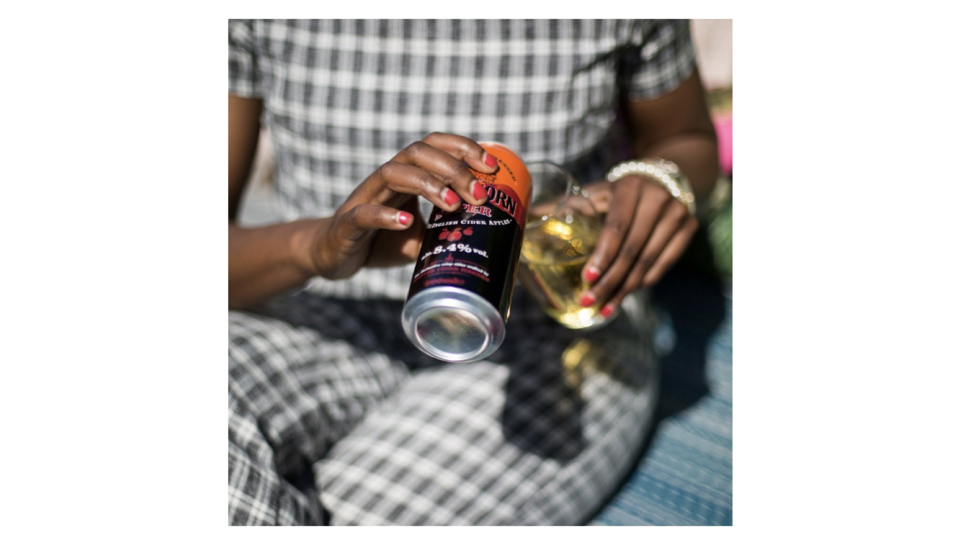 Woman drinking BlackThorn Super Apple Cider